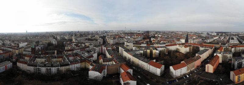 High angle view of city buildings against sky