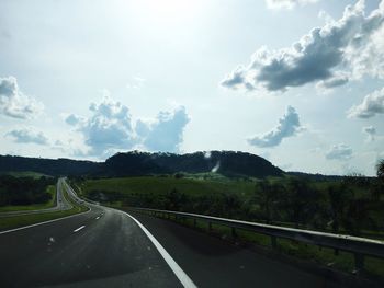 Empty country road along landscape