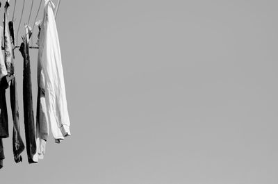 Close-up of clothes drying against white background