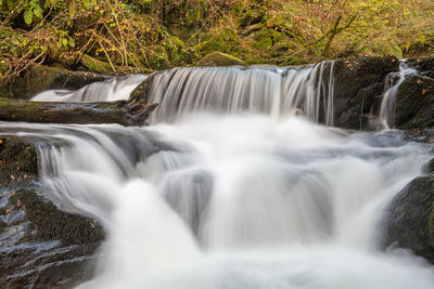 Long exposure of a waterfall on the hoar oak water river at watersmmet in exmoor national park 