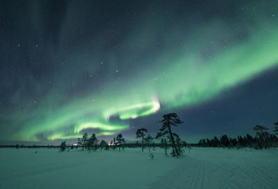 Scenic view of landscape against sky at night