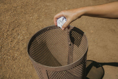 Close-up of hand holding skateboard