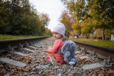 Full length of child on railroad track