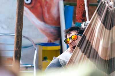 Portrait of young man wearing sunglasses