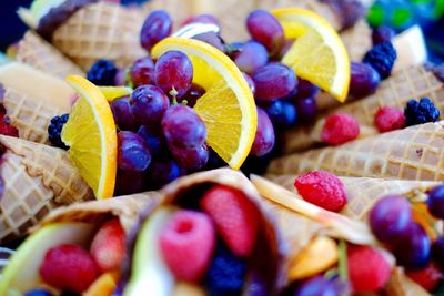 Full frame shot of various fruits in ice cream cone