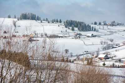 Snow covered field against sky