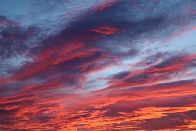 Low angle view of dramatic sky during sunset