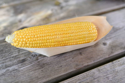 Close-up of corn on wooden table