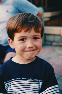 Close-up of boy smiling while looking away