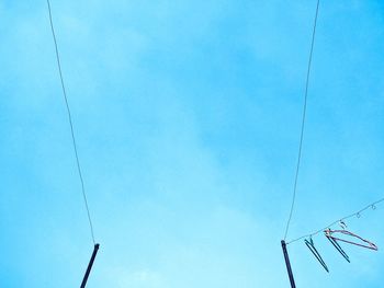 Low angle view of ski lift against sky