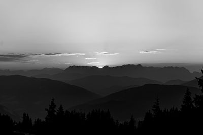 Scenic view of silhouette mountains against sky