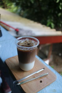 Cropped hand of man using mobile phone