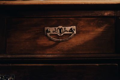 Close-up of text on wooden table