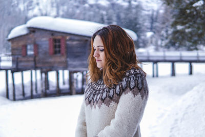 Woman standing on snow covered outdoors