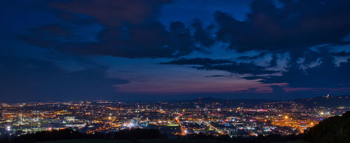 High angle view of illuminated buildings in city at night