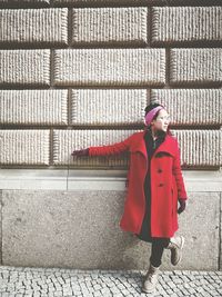 Full length of woman standing in snow