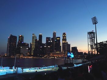 Low angle view of city lit up at night