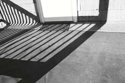 High angle view of sunlight falling on staircase in building