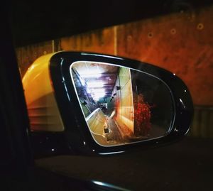 Reflection of car on side-view mirror