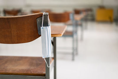 Close-up of empty chair on table