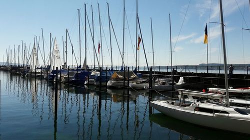 Boats moored at harbor