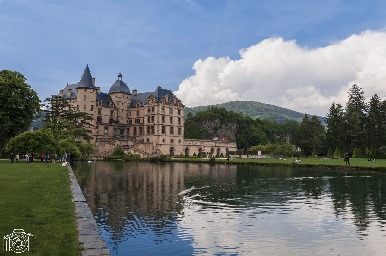 built structure, water, architecture, building exterior, sky, nature, tree, plant, waterfront, cloud - sky, reflection, travel destinations, day, history, lake, the past, travel, building, no people, outdoors