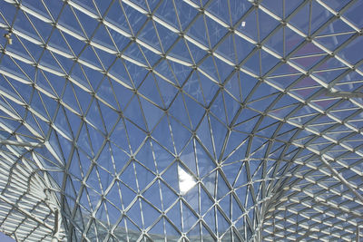 Low angle view of skylight against blue sky