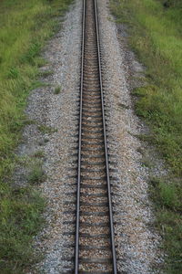 High angle view of railroad tracks on field