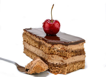 Close-up of cake against white background