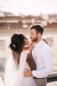 Young couple standing outdoors