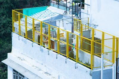 High angle view of snow covered fence against building