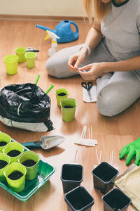 High angle view of woman preparing food on table