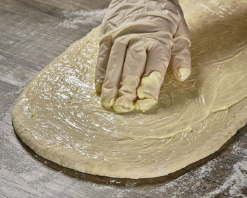 High angle view of person preparing food on table