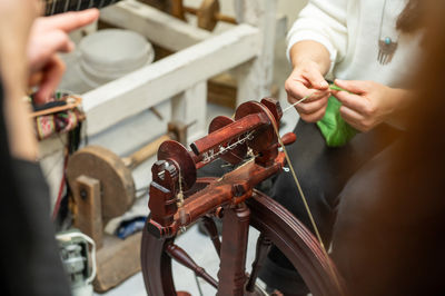 Midsection of man working in workshop