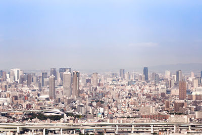 Aerial view of cityscape against sky