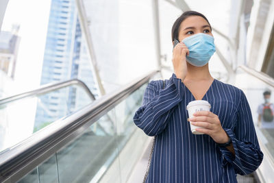 Midsection of woman drinking coffee