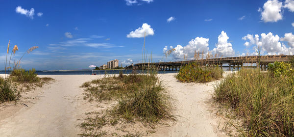 Panoramic shot of bridge over sea against sky