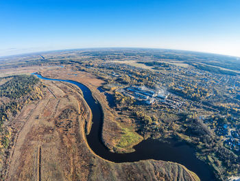 Aerial view of landscape against clear blue sky