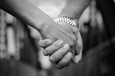 Close-up of couple with holding hands