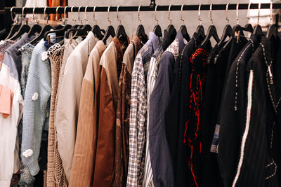 Close-up of clothes hanging in store