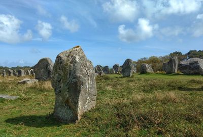 Rock formations on landscape against sky