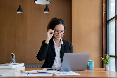 Businesswoman working at desk in office