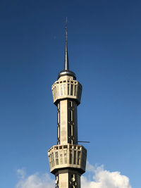 Low angle view of lighthouse against clear blue sky