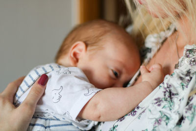 Cute baby sleeping on bed at home