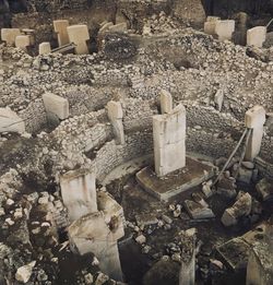 High angle view of damaged stone in cemetery