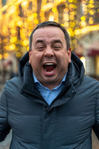 Portrait of man screaming outdoors