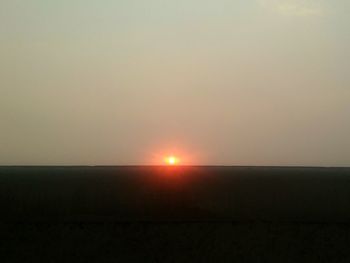 Scenic view of silhouette landscape against clear sky during sunset