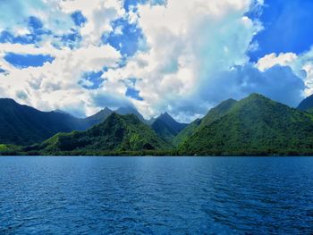 Scenic view of lake and mountains against sky