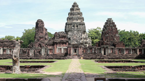 Old temple building against sky