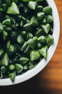 High angle view of chopped vegetables in bowl on table